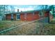 Features a fenced-in backyard with a well-maintained lawn and a brick house at 4018 S State Road 75, Coatesville, IN 46121