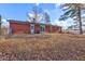 Spacious backyard with a well-maintained lawn and mature trees at 4018 S State Road 75, Coatesville, IN 46121