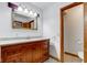 Bathroom featuring a marble counter vanity, mirror with lights, toilet, and tile floor at 4018 S State Road 75, Coatesville, IN 46121