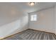Bedroom featuring an overhead light, window with blinds, neutral paint, carpet and baseboards at 4018 S State Road 75, Coatesville, IN 46121