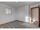 Bright bedroom featuring plush carpeting, a window, and neutral walls at 4018 S State Road 75, Coatesville, IN 46121