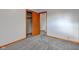 Bedroom features neutral carpet, white walls, wooden door to closet with open access at 4018 S State Road 75, Coatesville, IN 46121