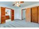 Bedroom with carpet, ceiling fan, ensuite access and closet at 4018 S State Road 75, Coatesville, IN 46121