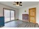 Dining room with hardwood floors, ceiling fan, and sliding glass doors at 4018 S State Road 75, Coatesville, IN 46121