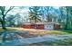 Charming single-story brick home with an attached garage and a spacious front yard at 4018 S State Road 75, Coatesville, IN 46121
