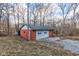 Exterior view of detached garage with a white door and brick siding at 4018 S State Road 75, Coatesville, IN 46121