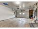 Spacious garage featuring a concrete floor, overhead door, and ample space at 4018 S State Road 75, Coatesville, IN 46121