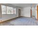 Bright living room with neutral carpet, white walls and a large window providing ample natural light at 4018 S State Road 75, Coatesville, IN 46121
