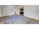 Bright living room with neutral carpet, white walls, and an open entryway to other rooms at 4018 S State Road 75, Coatesville, IN 46121