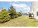 Spacious backyard featuring healthy green lawn and privacy trees to the side at 5142 Pin Oak Dr, Indianapolis, IN 46254