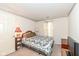 Comfortable bedroom featuring wallpaper trim, a bed with quilt, and side tables at 5142 Pin Oak Dr, Indianapolis, IN 46254