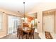Cozy dining area with sliding glass doors and a view into the kitchen, perfect for Gathering meals at 5142 Pin Oak Dr, Indianapolis, IN 46254