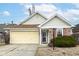 Charming single-story home featuring a brick facade, attached garage and inviting front yard at 5142 Pin Oak Dr, Indianapolis, IN 46254