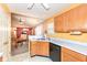 Functional kitchen featuring wood cabinetry, ample counter space, and a seamless transition to the dining area at 5142 Pin Oak Dr, Indianapolis, IN 46254