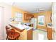 Efficient kitchen with wood cabinets, ample countertop space, and sunny window for a bright cooking experience at 5142 Pin Oak Dr, Indianapolis, IN 46254