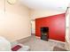 Cozy living room featuring carpet, light-colored walls, and a modern electric fireplace at 5142 Pin Oak Dr, Indianapolis, IN 46254