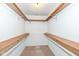 Spacious walk-in closet with built-in shelving offering ample storage solutions at 5142 Pin Oak Dr, Indianapolis, IN 46254