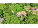 Aerial view of a home on a large lot with mature trees and a pool at 5272 N Graham Rd, Whiteland, IN 46184