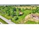 Aerial view of a home on a large lot with mature trees and a detached garage at 5272 N Graham Rd, Whiteland, IN 46184