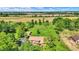 Aerial view of a house on a large lot with mature trees and a detached garage at 5272 N Graham Rd, Whiteland, IN 46184