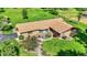 Aerial view showcases the home's unique architecture, beautiful landscaping, and well-manicured lawn at 5272 N Graham Rd, Whiteland, IN 46184