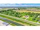Aerial view of a home on a large lot with mature trees and a detached garage at 5272 N Graham Rd, Whiteland, IN 46184