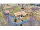 Aerial view of a house with a circular driveway, detached garage, and beautiful landscaping at 5272 N Graham Rd, Whiteland, IN 46184