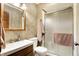 Cozy bathroom featuring a shower with glass doors, vanity with mirror and wood cabinets at 5272 N Graham Rd, Whiteland, IN 46184