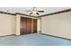 Bedroom with a large closet with panel doors, ceiling fan and light blue carpet flooring at 5272 N Graham Rd, Whiteland, IN 46184