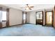 Bedroom featuring carpet, a ceiling fan, light walls, and an ensuite bathroom at 5272 N Graham Rd, Whiteland, IN 46184