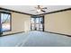 Bright and spacious bedroom with large windows, soft blue carpet, and ample natural light at 5272 N Graham Rd, Whiteland, IN 46184