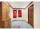 Well-lit bedroom with red blinds, ceiling fan, and carpeted floor at 5272 N Graham Rd, Whiteland, IN 46184