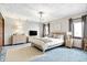 Serene bedroom with a neutral color palette, ample natural light, and comfortable furnishings, creating a peaceful retreat at 5272 N Graham Rd, Whiteland, IN 46184