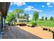 Spacious wooden deck offers an inviting space for outdoor dining and relaxation at 5272 N Graham Rd, Whiteland, IN 46184