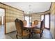 Formal dining room with an ornate table, chandelier, and patterned wallpaper at 5272 N Graham Rd, Whiteland, IN 46184