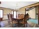 Elegant dining room featuring a chandelier and traditional wallpaper at 5272 N Graham Rd, Whiteland, IN 46184