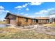 Beautiful stone facade home with a two-car garage and well-maintained front yard on a sunny day at 5272 N Graham Rd, Whiteland, IN 46184