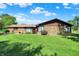 Charming ranch home with stone facade and well-maintained lawn under a partly cloudy sky at 5272 N Graham Rd, Whiteland, IN 46184