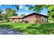 Charming one-story home with stone facade, manicured lawn and professional landscaping at 5272 N Graham Rd, Whiteland, IN 46184