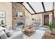 Living area showcasing a stone fireplace, neutral furnishings, and stylish decor at 5272 N Graham Rd, Whiteland, IN 46184