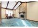 Cozy living room with stone fireplace, wood beams, and bright natural light at 5272 N Graham Rd, Whiteland, IN 46184