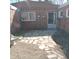Charming backyard with a brick patio and mature landscaping at 5506 N Drexel Ave, Indianapolis, IN 46220