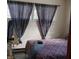Bright bedroom with patterned bedding and natural light through the windows at 5506 N Drexel Ave, Indianapolis, IN 46220
