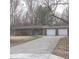 Ranch-style home with a long driveway and two-car garage at 5506 N Drexel Ave, Indianapolis, IN 46220