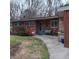 Charming brick home with a quaint front porch and garden at 5506 N Drexel Ave, Indianapolis, IN 46220