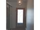 Entry hallway featuring a decorative door and mirrored closet at 5506 N Drexel Ave, Indianapolis, IN 46220