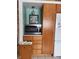 Charming kitchen with wooden cabinets and granite countertops, featuring modern appliances and ample storage space at 5506 N Drexel Ave, Indianapolis, IN 46220
