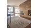Inviting living room with a stone fireplace, hardwood floors, and an abundance of natural light from large windows at 5506 N Drexel Ave, Indianapolis, IN 46220