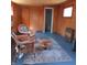 Comfortable living room area with wicker seating and vintage charm at 5506 N Drexel Ave, Indianapolis, IN 46220