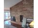 Living room showcasing a unique brick fireplace and hardwood floors at 5506 N Drexel Ave, Indianapolis, IN 46220